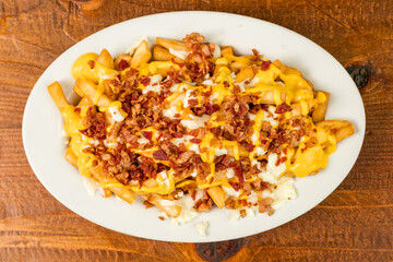 Loaded cheese fries on a plate