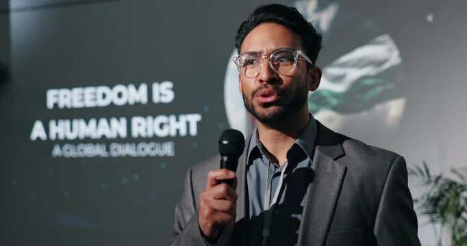 Businessman, presentation or seminar with speech for human rights, freedom or political statement. Man, speaker or spokesperson talking with mic for free palestine, cease fire or peace in humanity