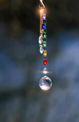 Colorful sun catcher crystal prism close up outdoor, abstract nature background. Magic Ritual, healing practice with crystals for positive spirit, harmony, calming, productive the mind. reiki therapy