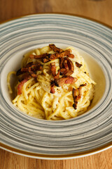 Traditional spaghetti carbonara with crispy pancetta