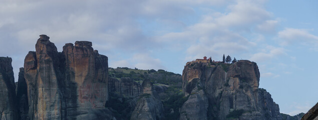 Panoramic view of landscape of Meteora rock formations with St. Stephan Monastery on top of the rocks during sunset, Kalambaka, Thessaly, Greece
