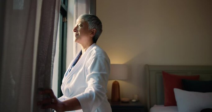 Curtains, morning and smile with old woman in hotel room for accommodation or hospitality. Retirement, wake up and window with happy senior person at lodge or resort for holiday, travel and vacation