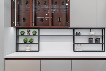 large corner built-in kitchen with upper and lower cabinets. Modern kitchen in light grey with...