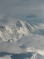 Aerial view of Antarctica white mountains.
