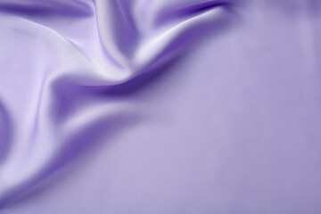 Crumpled violet silk fabric as background, top view. Space for text