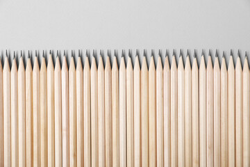 Many graphite pencils on grey background, flat lay