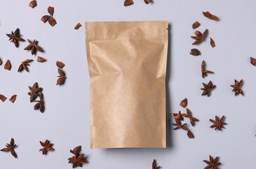 One zipper stand-up pouch with star anise on light grey background, flat lay. Mockup for design