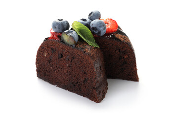 Pieces of delicious chocolate bundt cake with strawberries, mint and blueberries isolated on white