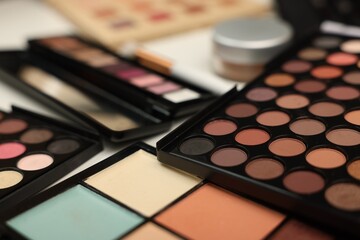 Different makeup products on dressing table indoors, closeup