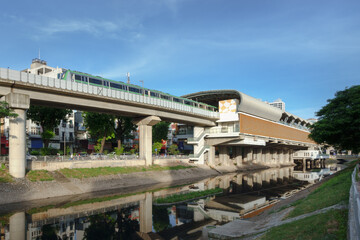 Electric train glides through Hanoi, showcasing urban transport and modern infrastructure