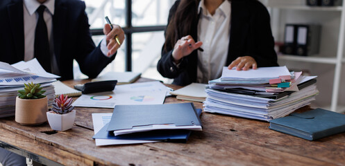 Accounting record with analyze financial data calculator in meeting office, Accounting company charts and graphs banner, double exposure successful business finance and taxation planning concept.