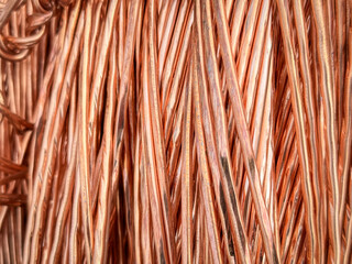 Aligned copper wires displaying consistent patterns and detailed textures in a parallel arrangement.