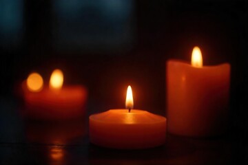 Close-up of flickering candlelight illuminating a dark room, creating a warm and inviting atmosphere Perfect for home decor, relaxation, and spiritual themes , stillness, candlelit