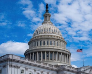 United States Capitol Building facade under blue skies adorned with clouds