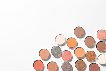Beautiful eyeshadow refill pans on white background, flat lay. Space for text