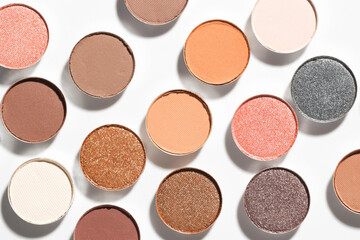 Beautiful eyeshadow refill pans on white background, flat lay