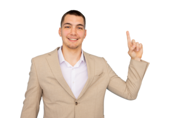Young businessman smiling confidently while pointing upwards with his index finger, set against a transparent background