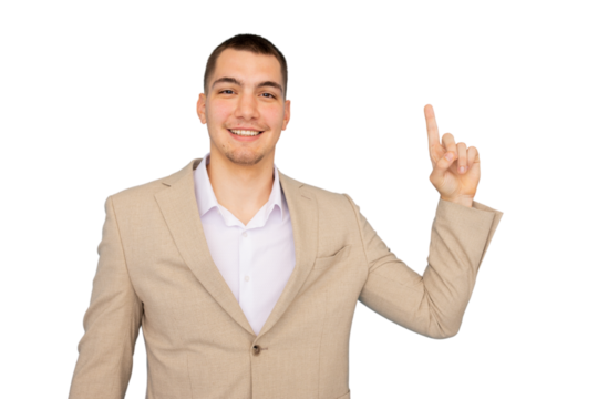 Young businessman smiling confidently while pointing upwards with his index finger, set against a transparent background