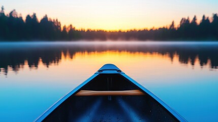   A canoe rests on water, surrounded by towering trees and a hazy sky above