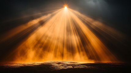 Dramatic golden light rays shining down onto a mysterious foggy landscape scene
