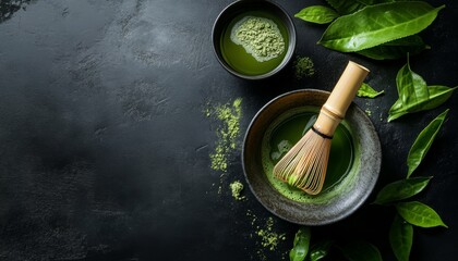 Japanese Matcha Green Tea Brewing Tradition. Green tea brewing equipment, fresh green tea leaf . matcha whisk near matcha powder in bowl on black background with Copyspace. Top view