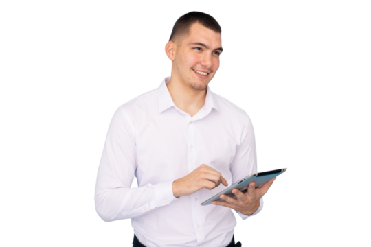 Young entrepreneur browsing on his tablet, looking away and smiling, isolated on transparent background