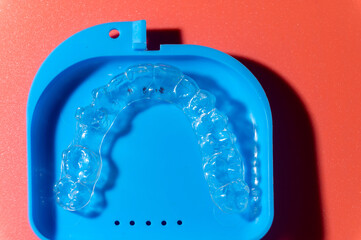 Transparent aligners and storage case. Invisible braces. Clear teeth straighteners. plastic bracers ready to use