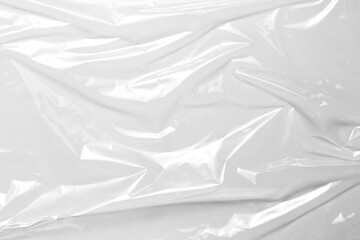 plastic overlay texture of realistic crumpled transparent plastic film wrap on black background,wrinkled stretched plastic effect.
