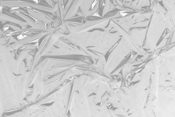 plastic overlay texture of realistic crumpled transparent plastic film wrap on black background,wrinkled stretched plastic effect.