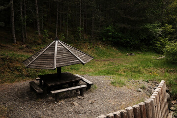 Wooden picnic shelter in the forest of Mokra Gora, perfect for rest near the river Kamisna. Serbia country nature in spring season.