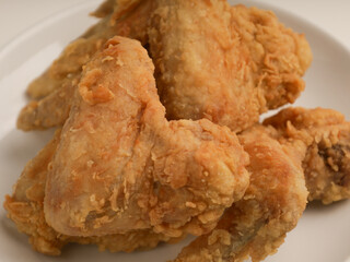 Piled of fried chicken on white background