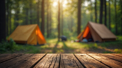 Wood table and Blurred camping and tents in forest	