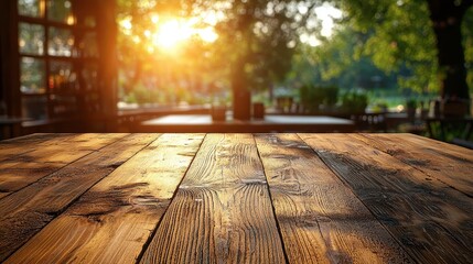 A blurred, inviting scene of a bustling coffee shop and restaurant, where the warm glow of sunlight illuminates a spacious interior and an empty, wooden table beckons for a captivating display 