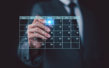 Business people use work schedules in business as a technological plan and project for proper...