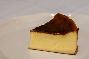 Burnt Basque cheesecake served on plate on the table