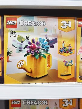 01.06.2025, Alanya, Turkey. LEGO Creator 3-in-1 set featuring a yellow watering can with flowers, with alternate bird and boot builds. On a toy store shelf. Creativity, versatile play, DIY flower kit.
