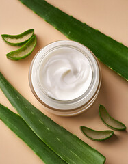 Face moisturizer with sliced aloe vera leaves beside it, fresh and organic beauty product layout, natural tones, top-down view