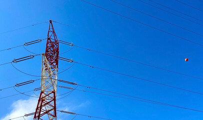 High voltage towers on a blue sky background. Electrical power lines in Tenerife,Canary...