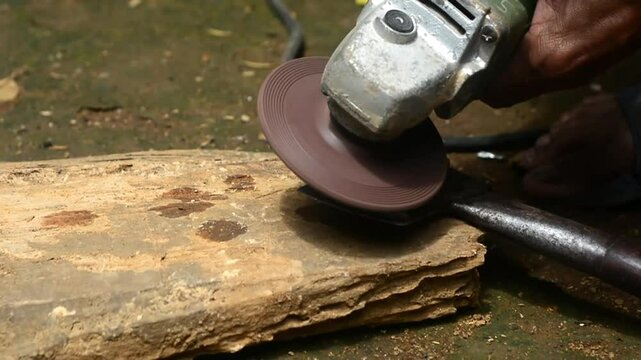 Isolated close up of chef knife sharpening, honing and stropping process by  a skilled craftsman. Vintage old school craftsman at work in grange shop showing true professional skills.