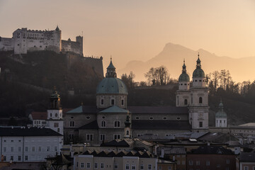 Salzburg, Austria: Dramatic sunset over Salzburg old town with the hilltop fort, castle and the Salzbur Dom, the Cathedral in Austria