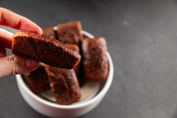 Financier biscuit chocolate cookie sweet dessert fresh delicious gourmet food background on the table rustic food top view copy space
