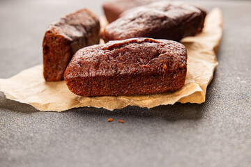Financier biscuit chocolate cookie sweet dessert fresh delicious gourmet food background on the table rustic food top view copy space