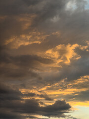 Golden Evening Sky with Dramatic Clouds at Sunset