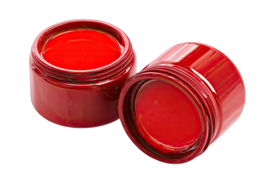Two glossy, red jars, possibly cosmetic, are positioned slightly offset
