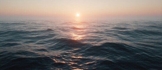 Sunrise over a misty sea