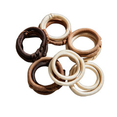 Circular, woven, light-brown, dark-brown, and cream-colored rings,  grouped