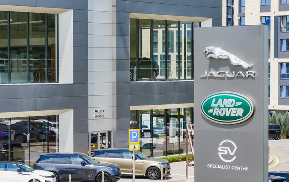 Almaty, Kazakhstan - May 29, 2025: Jaguar Land Rover emblem near the car dealership
