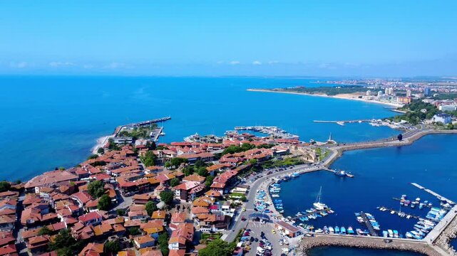 Panoramic drone view of Old Town Nessebar, Bulgaria, on the Black Sea coast. The ancient peninsula features traditional architecture, historic ruins, and medieval towers&mdash;part of UNESCO World Heritage.