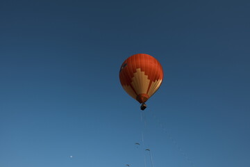 A hot air balloon is flying in the sky