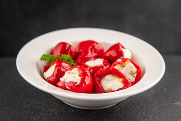 Hot peppers cheese filling pickled vegetables appetizer fresh delicious gourmet food vegetarian background on the table rustic food top view copy space keto and paleo diet
